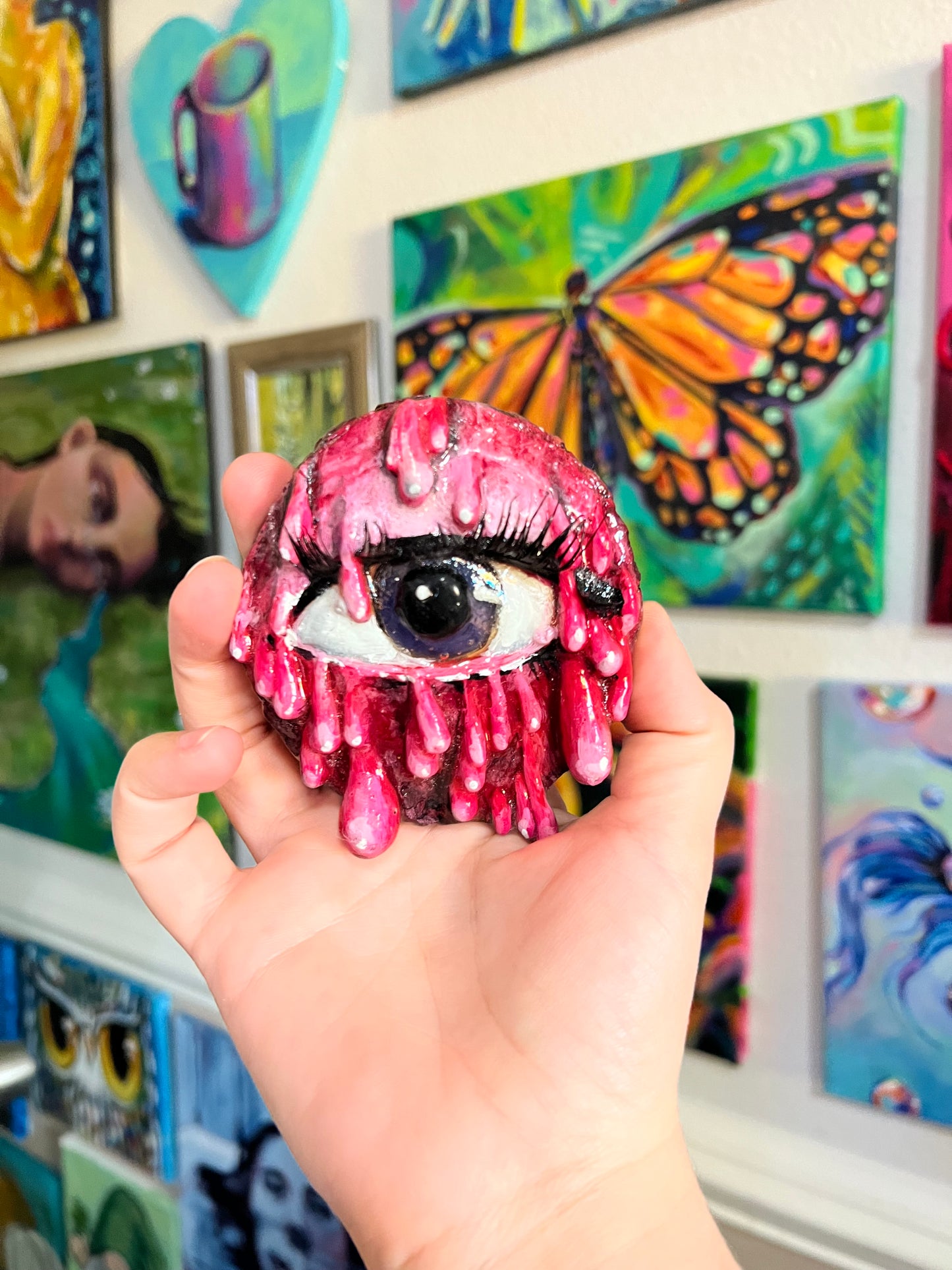 Pink dripping eye sculpture