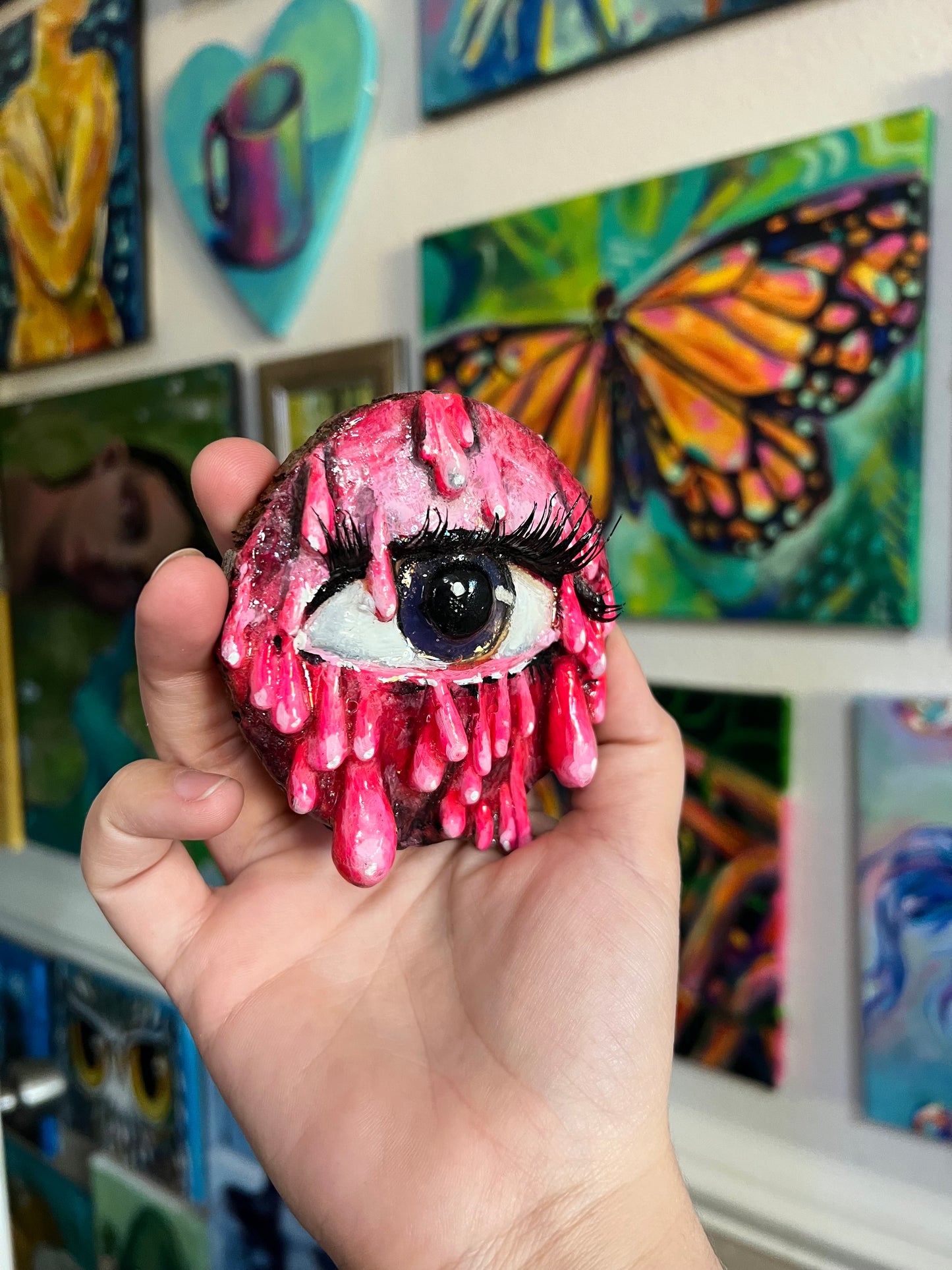 Pink dripping eye sculpture